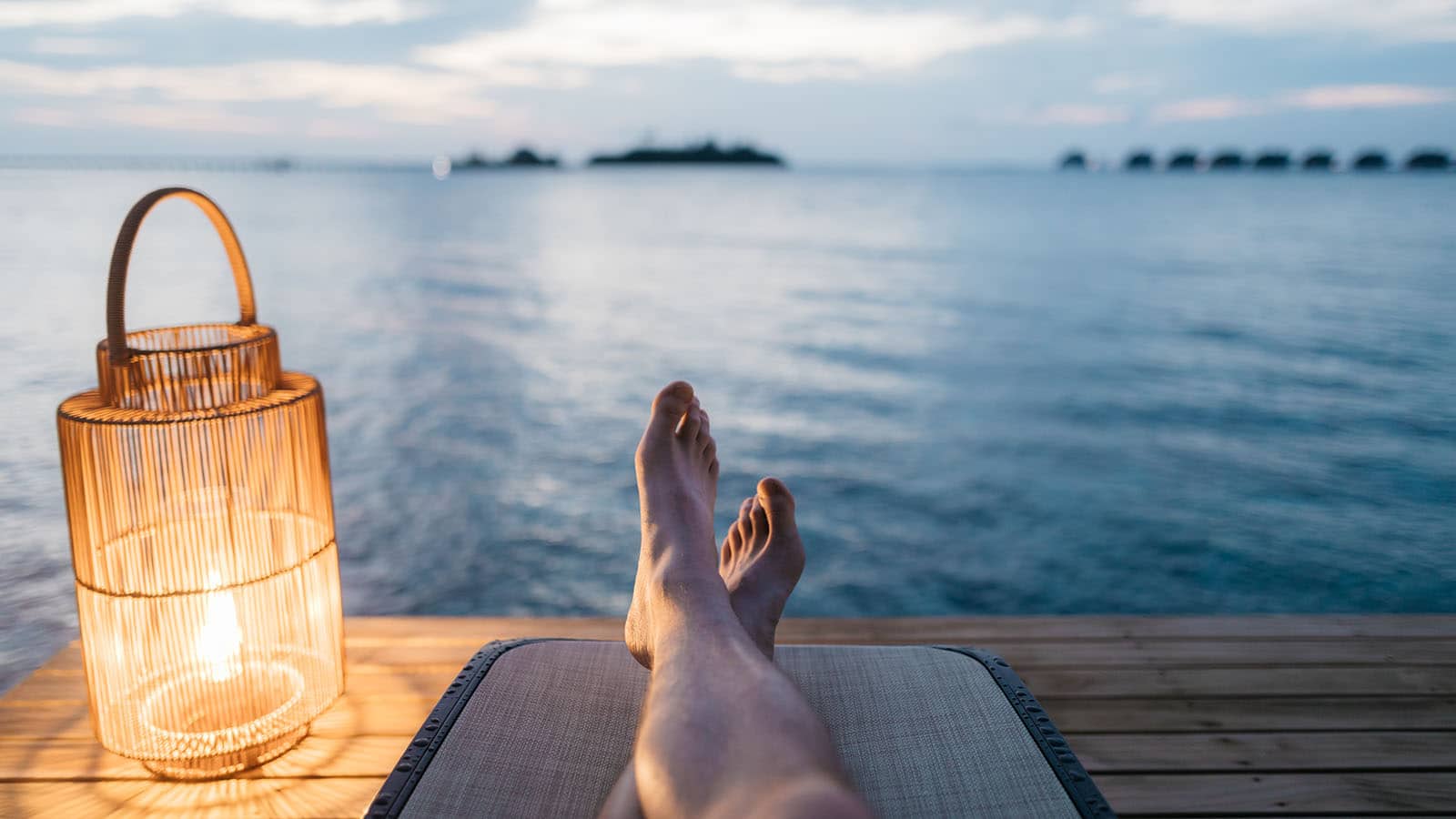 Feet relaxing near lake image