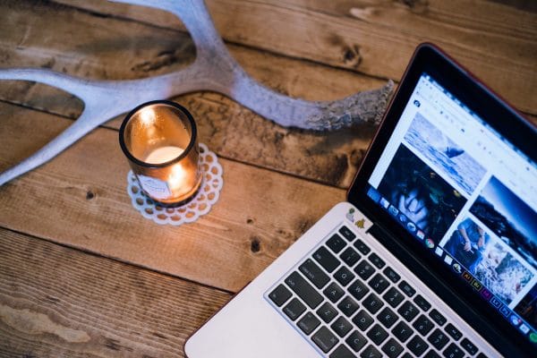 candle next to laptop