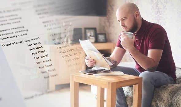 man looking at energy bill