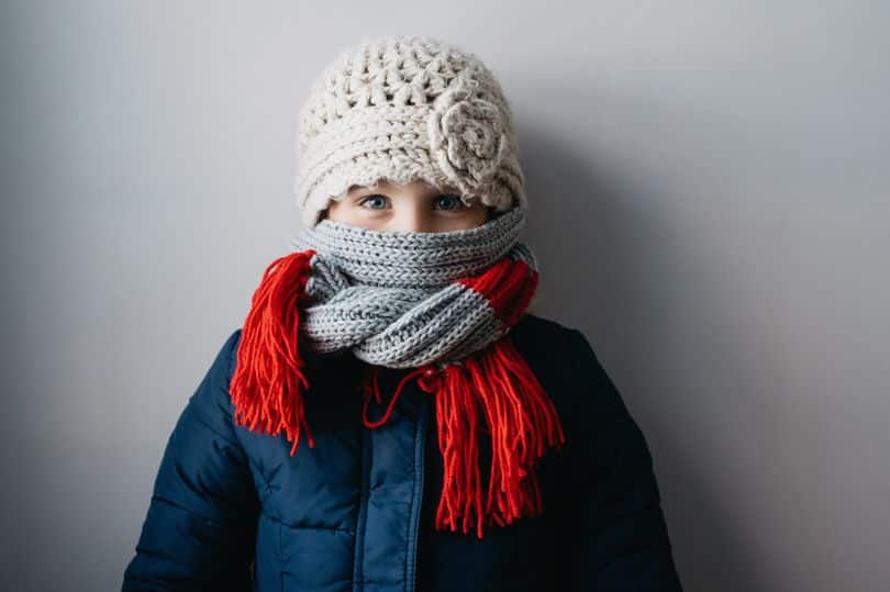 child wrapped up in scarf